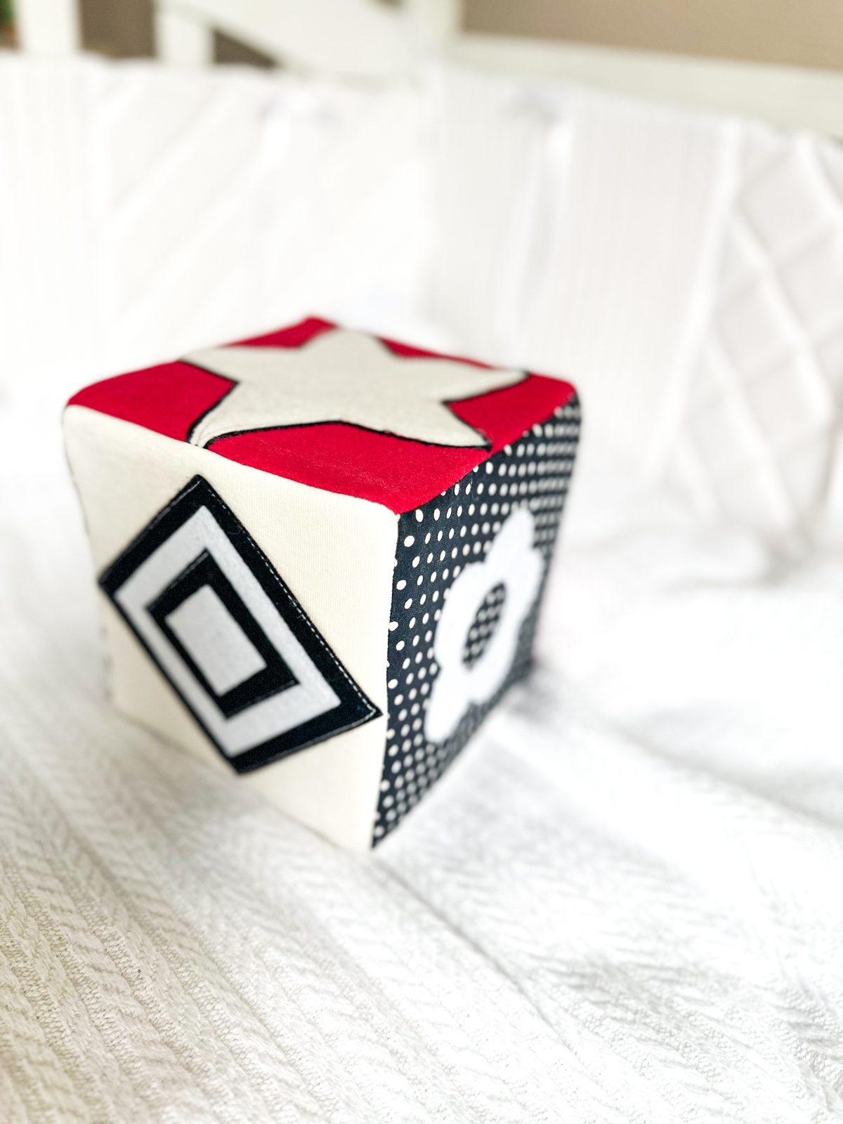 Handmade contrast sensory cube with high-contrast patterns and interactive textures