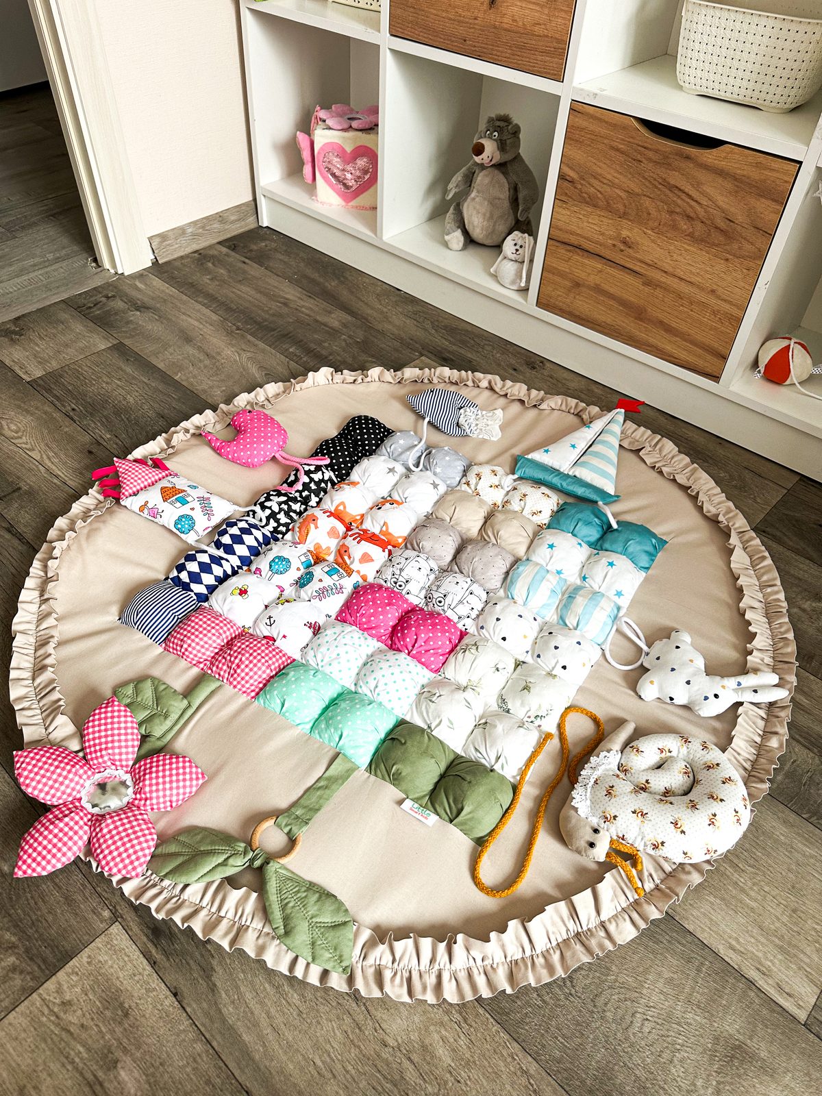 Handmade sensory play mat for baby with soft cotton textures and crinkle details