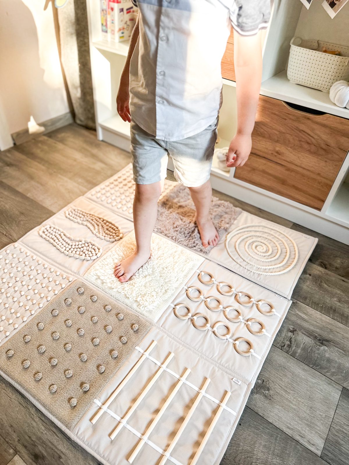 Handmade sensory walking path mat with different textures for barefoot toddler play