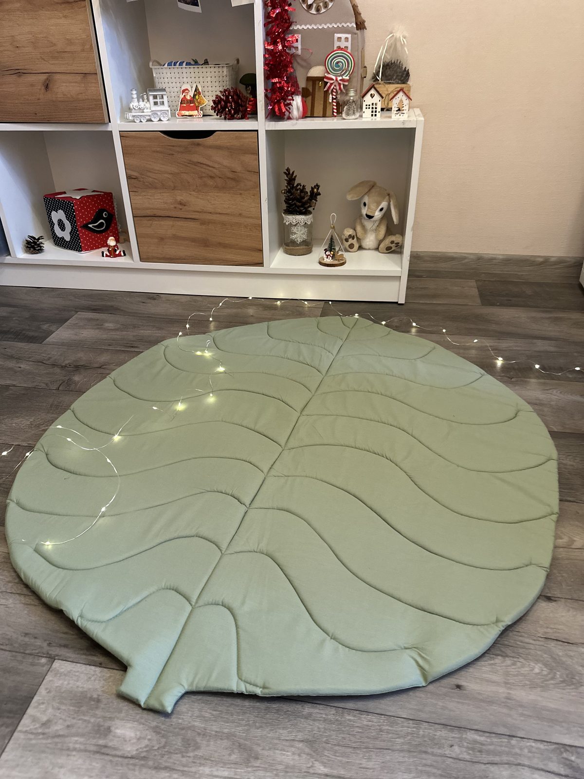 Handmade leaf-shaped sensory play mat with natural cotton textures